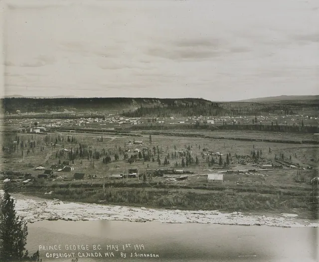 Black and white photograph of the young city of Prince George in May 1919, with low wooden buildings and cleared land